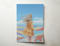 Illustrated wall art print of a girl with long hair blowing in the wind, standing in a colorful desert landscape under a blue sky.