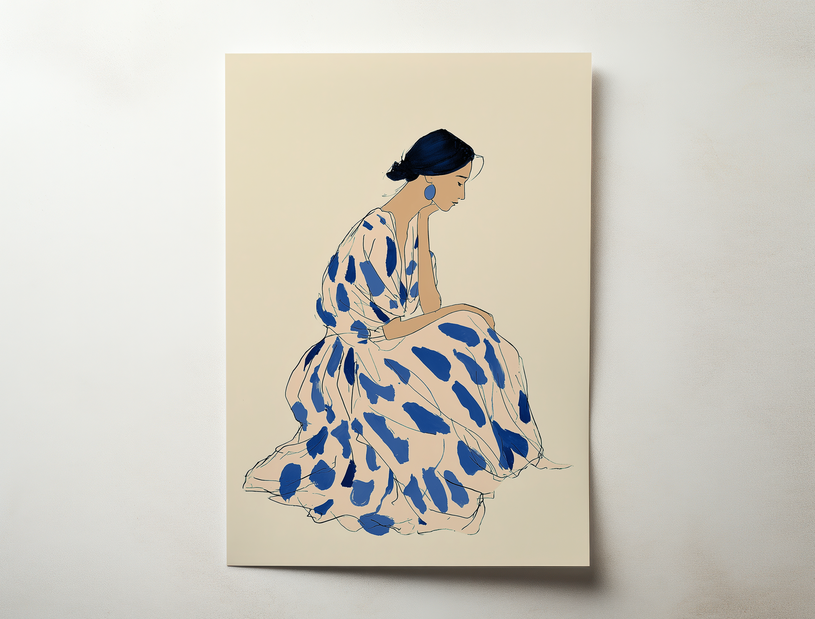 Framed minimalist artwork of a seated female figure in soft beige tones with blue accents, modern and elegant wall art