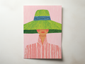 Livia modern fashion portrait wall art showing a woman wearing a wide green hat and striped blouse on a soft pink background