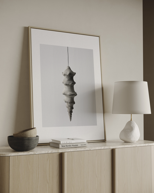Minimal neutral wall art with sculptural hanging form