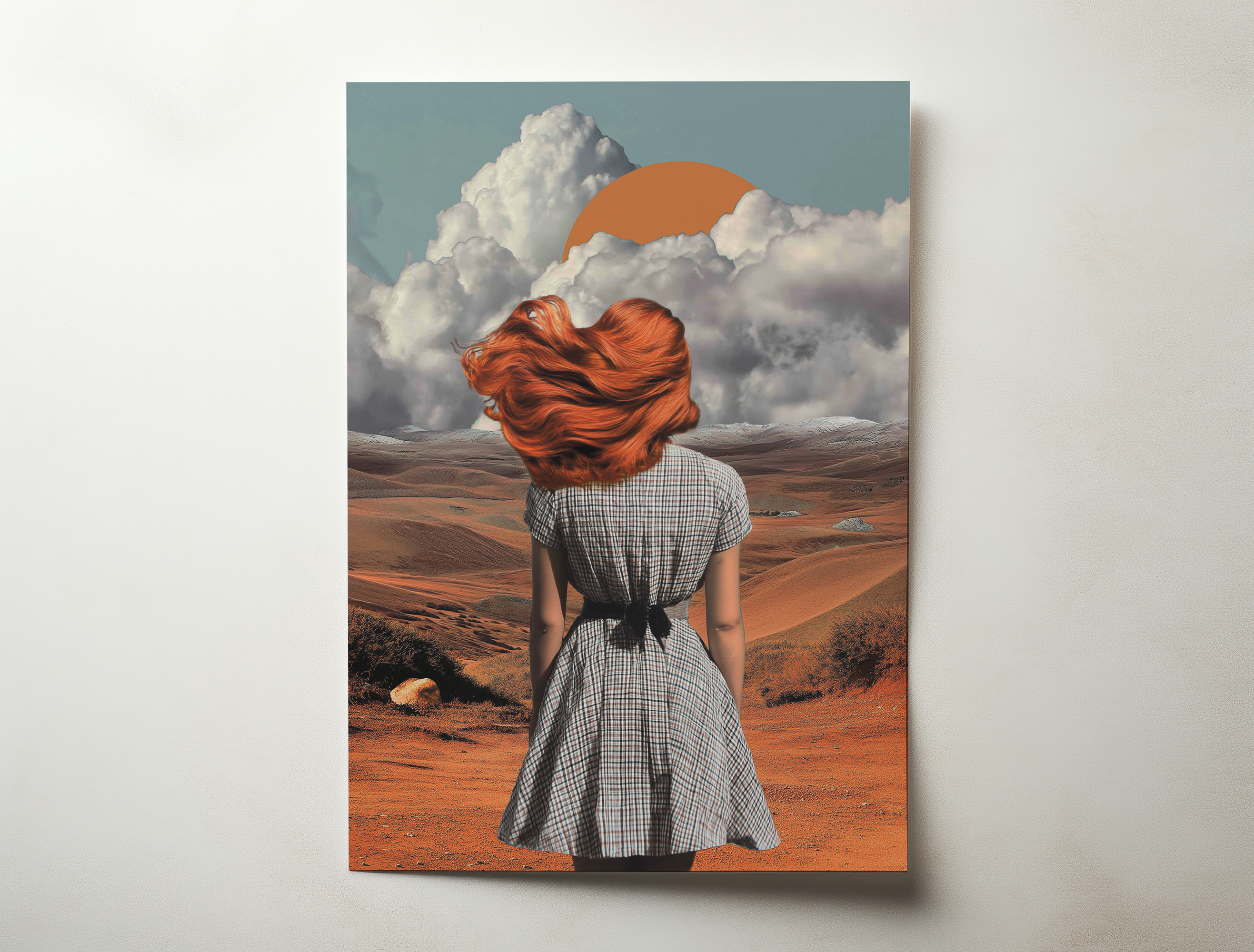 Aurelia desert portrait wall art showing a woman with flowing red hair standing in a vast desert landscape beneath dramatic clouds and a rising sun