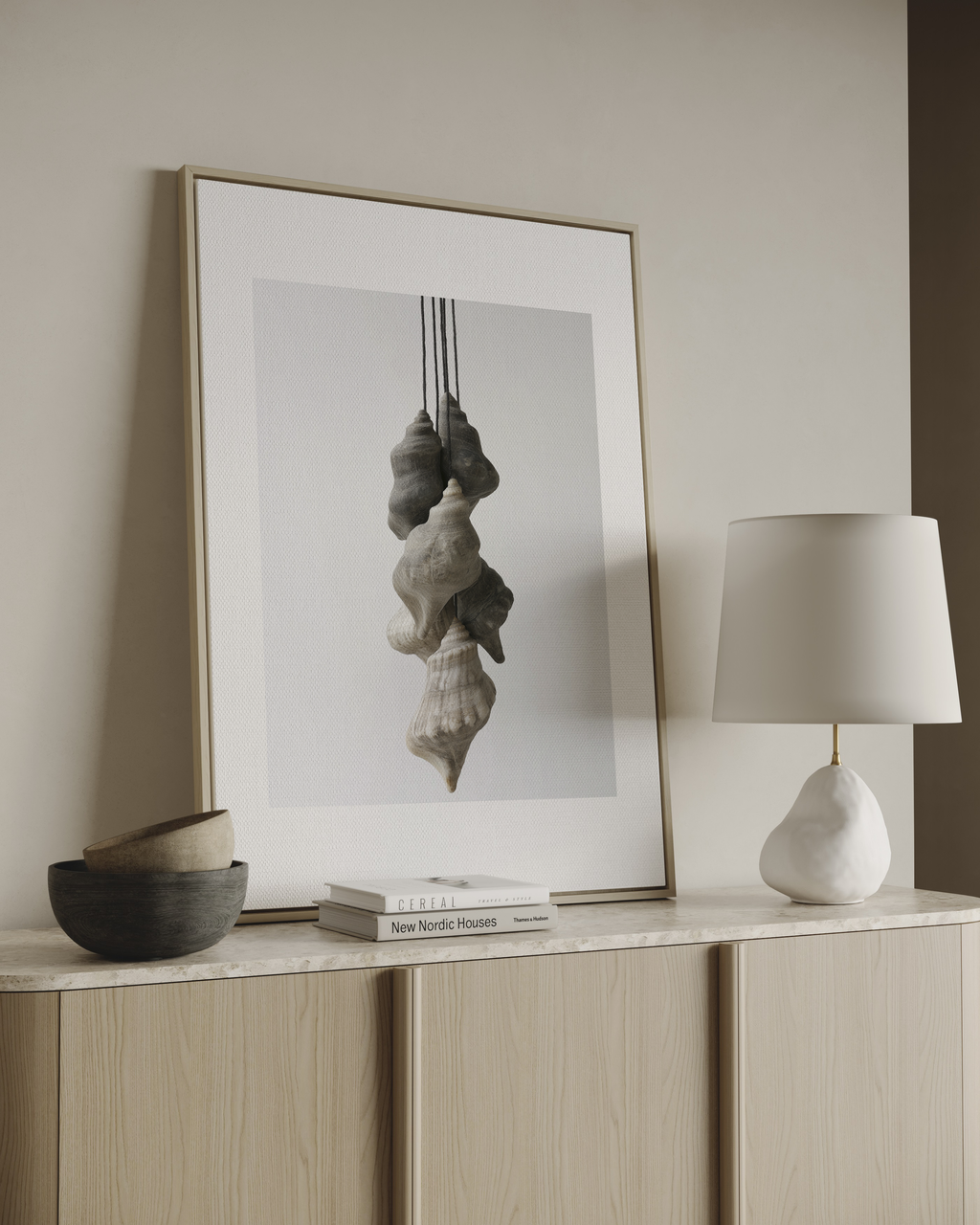 Minimal wall art with layered hanging sculptural forms